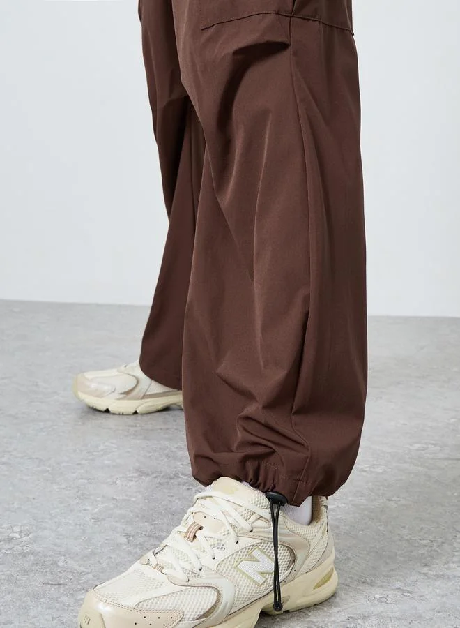 Styli  Men Oversized Front Pleat Cargo Pants for Men | Best Price UAE